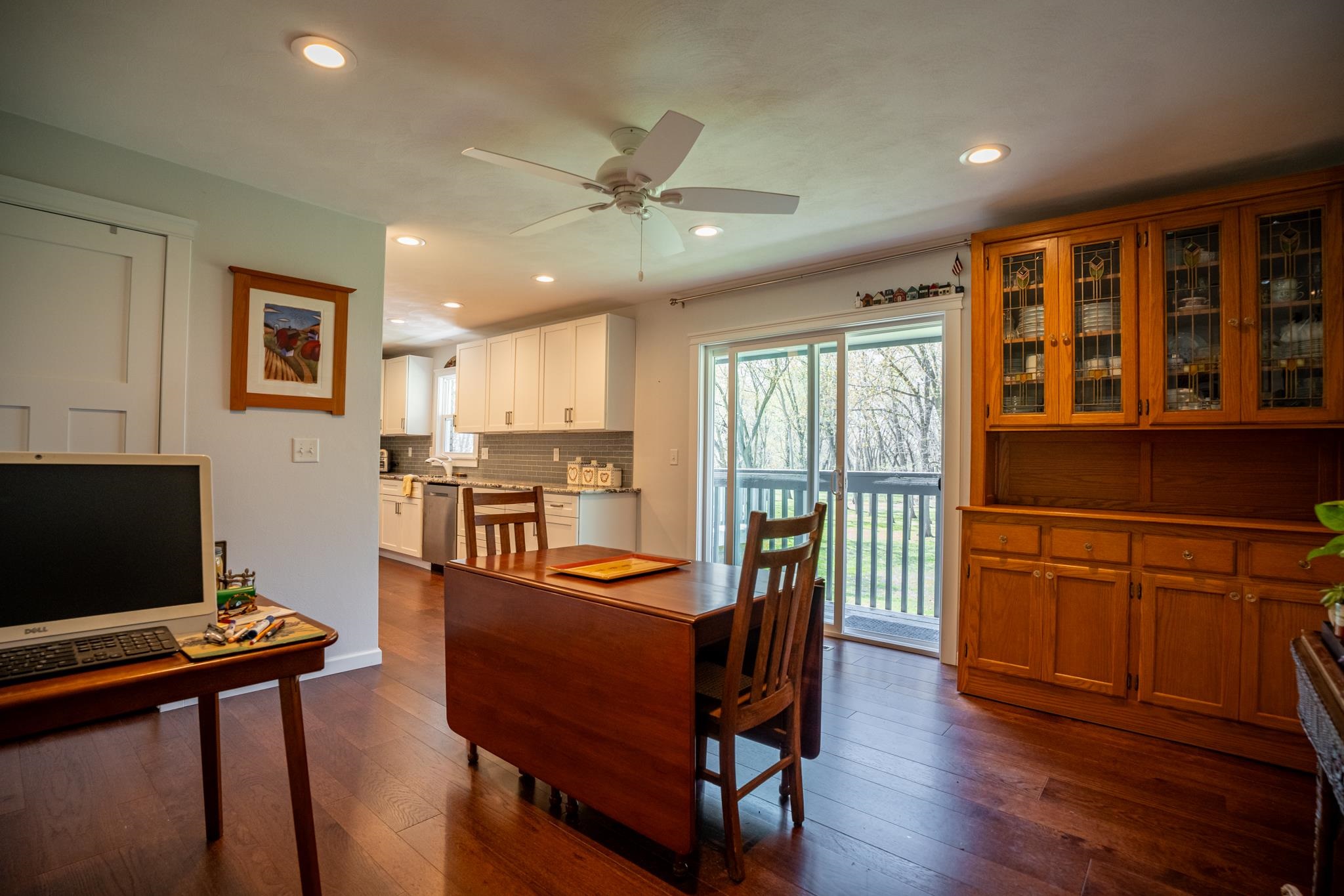 5968 East Bradley Road Byron, IL 61010 - Photo 18 of 40 a open dining room with furniture and wooden floor