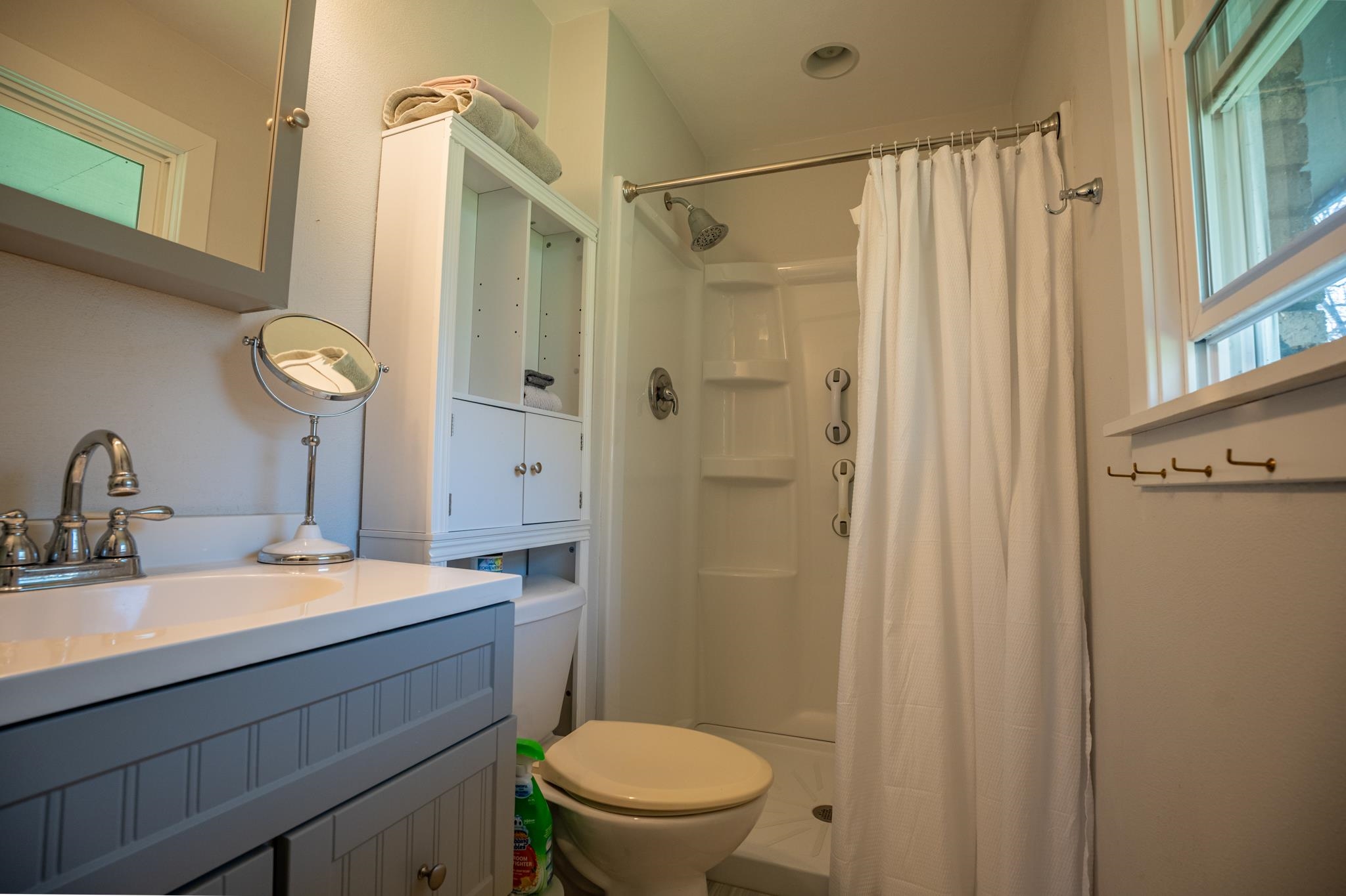 5968 East Bradley Road Byron, IL 61010 - Photo 21 of 40 a bathroom with a granite countertop sink toilet a mirror a vanity and shower