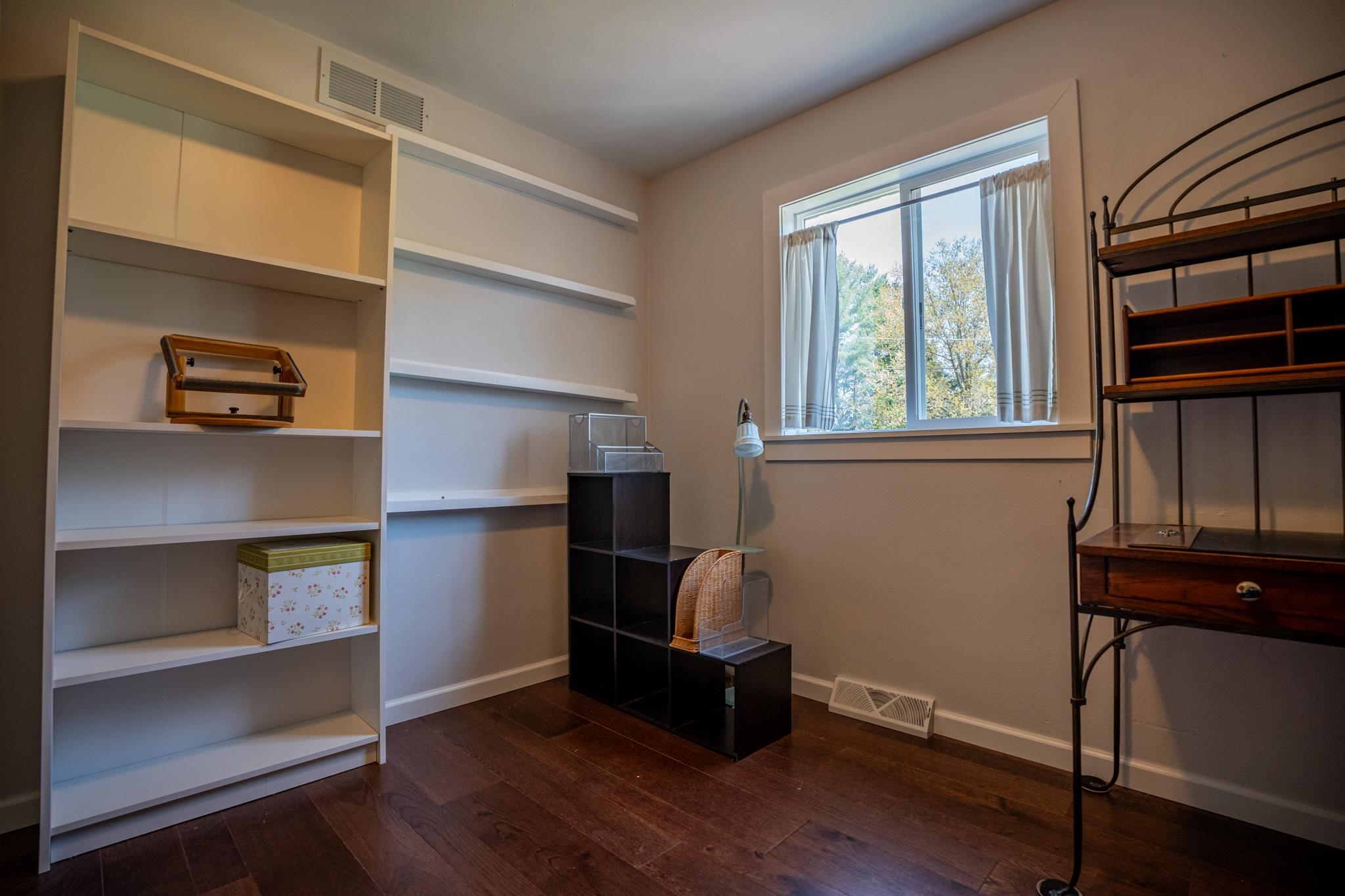 5968 East Bradley Road Byron, IL 61010 - Photo 22 of 40 a room with wooden floor and windows