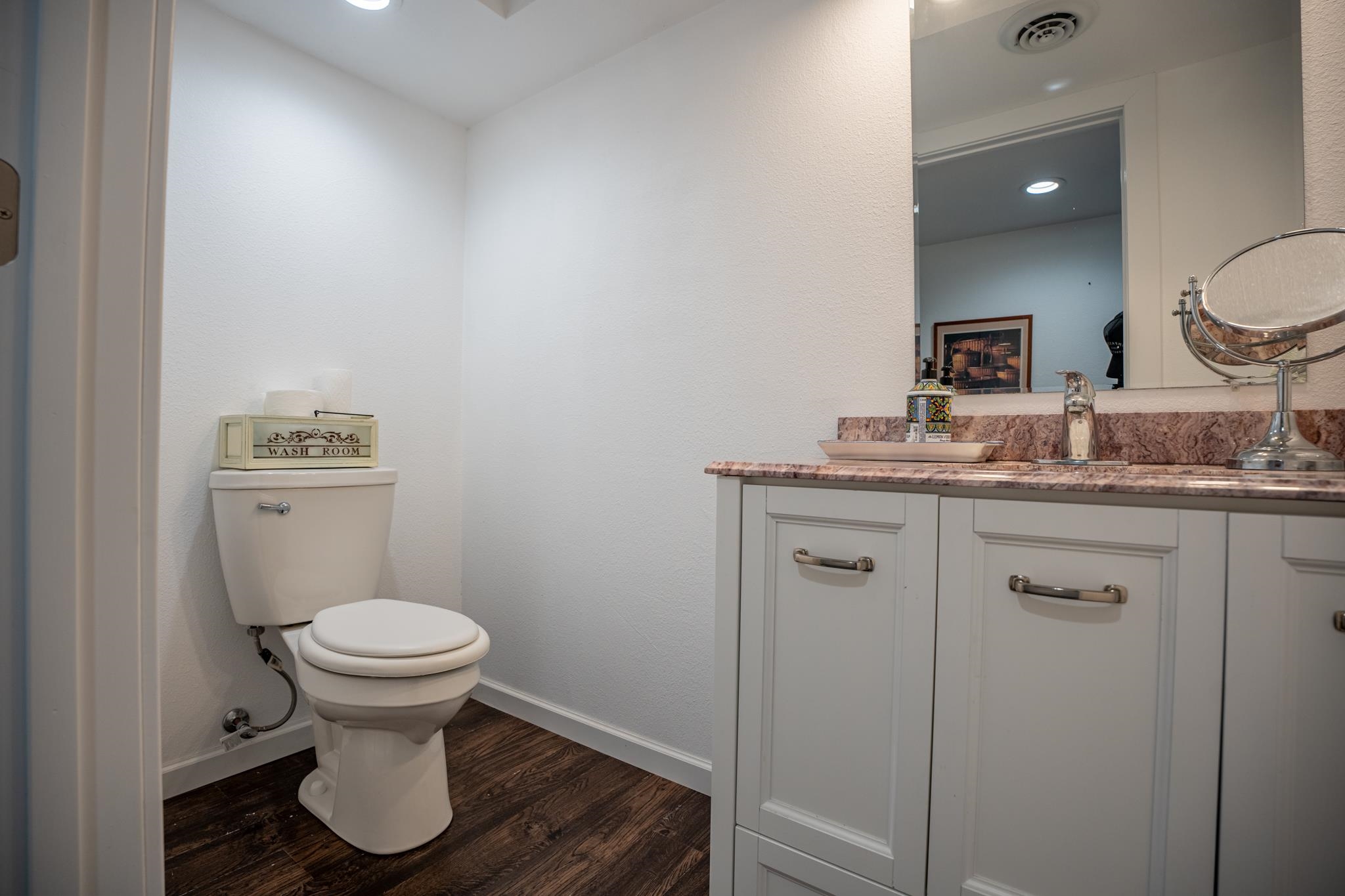 5968 East Bradley Road Byron, IL 61010 - Photo 25 of 40 a bathroom with a sink toilet and a mirror