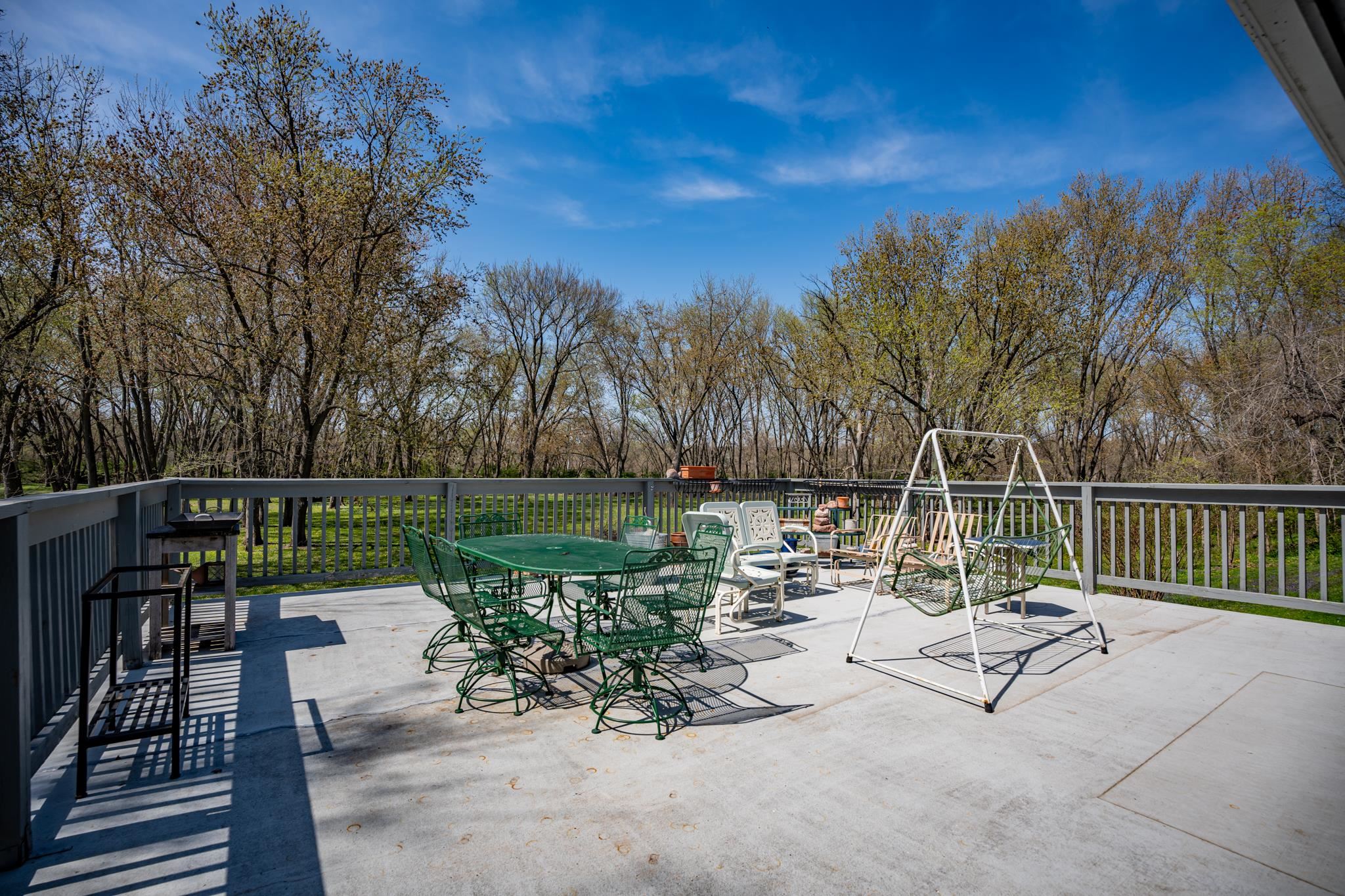 5968 East Bradley Road Byron, IL 61010 - Photo 26 of 40 a view of a chair and table in the patio