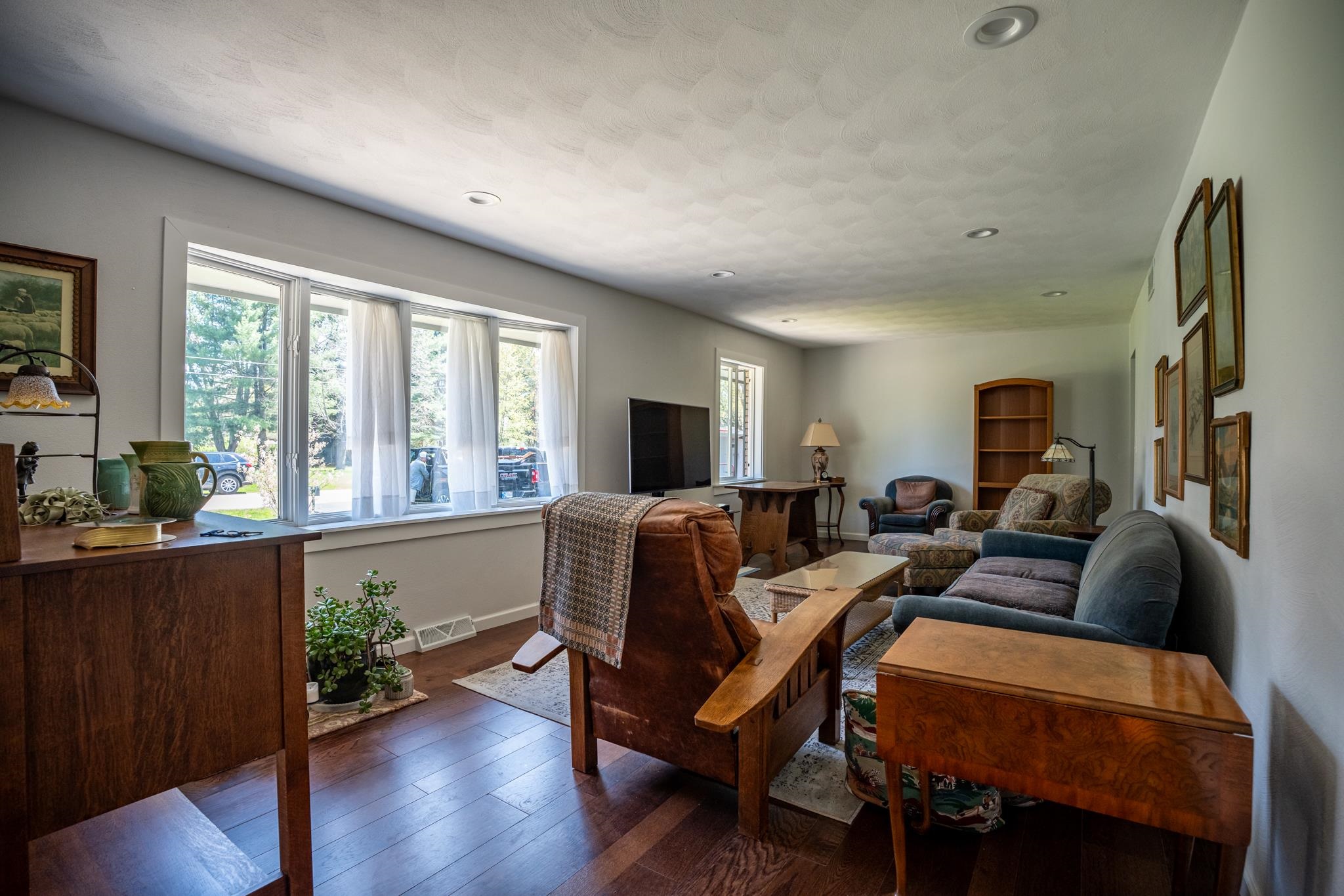 5968 East Bradley Road Byron, IL 61010 - Photo 7 of 40 a living room with furniture a large window and wooden floor