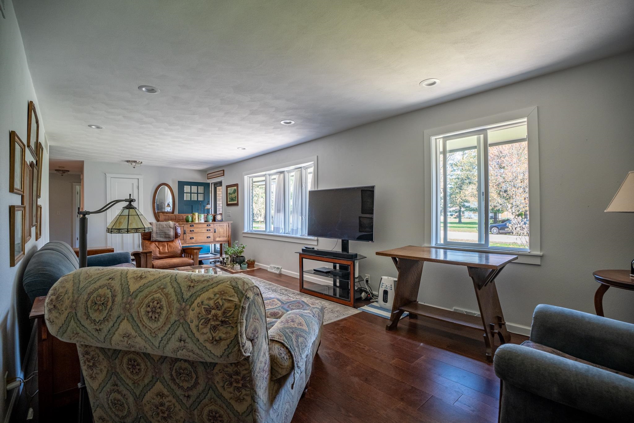 5968 East Bradley Road Byron, IL 61010 - Photo 9 of 40 a living room with furniture a window and a flat screen tv