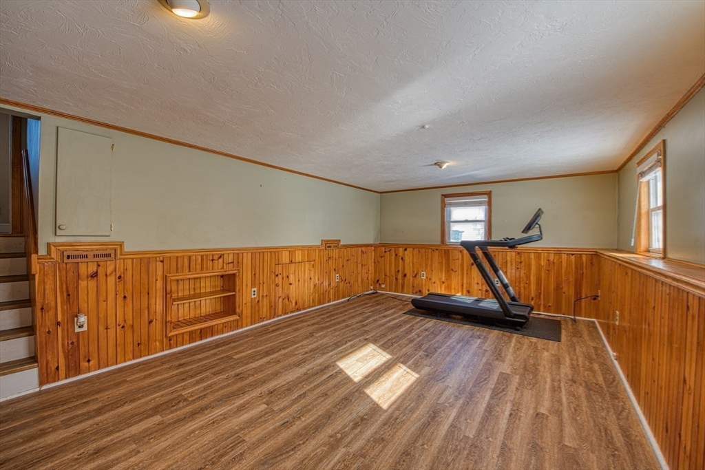 12 Brewster Road Randolph, MA 02368 - Photo 16 of 27 a view of a room with wooden floors