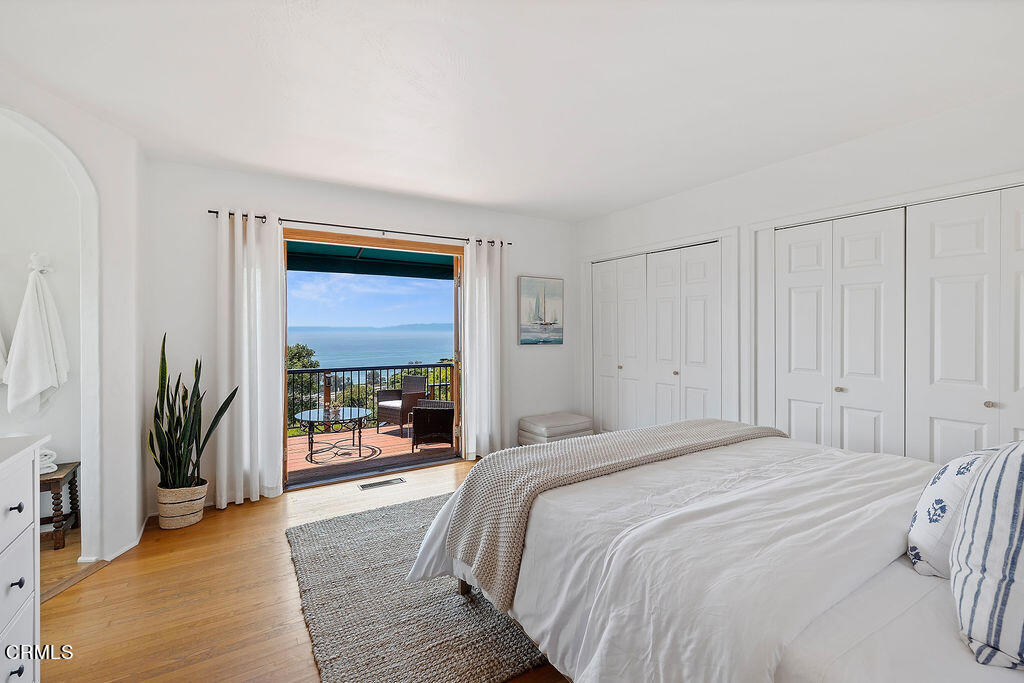 2335 Whitney Avenue Summerland, CA 93067 - Photo 16 of 33 a bedroom with a bed and a large window with outer view