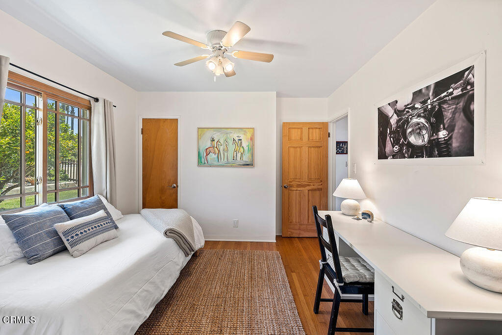 2335 Whitney Avenue Summerland, CA 93067 - Photo 22 of 33 a bedroom with a bed and wooden floor