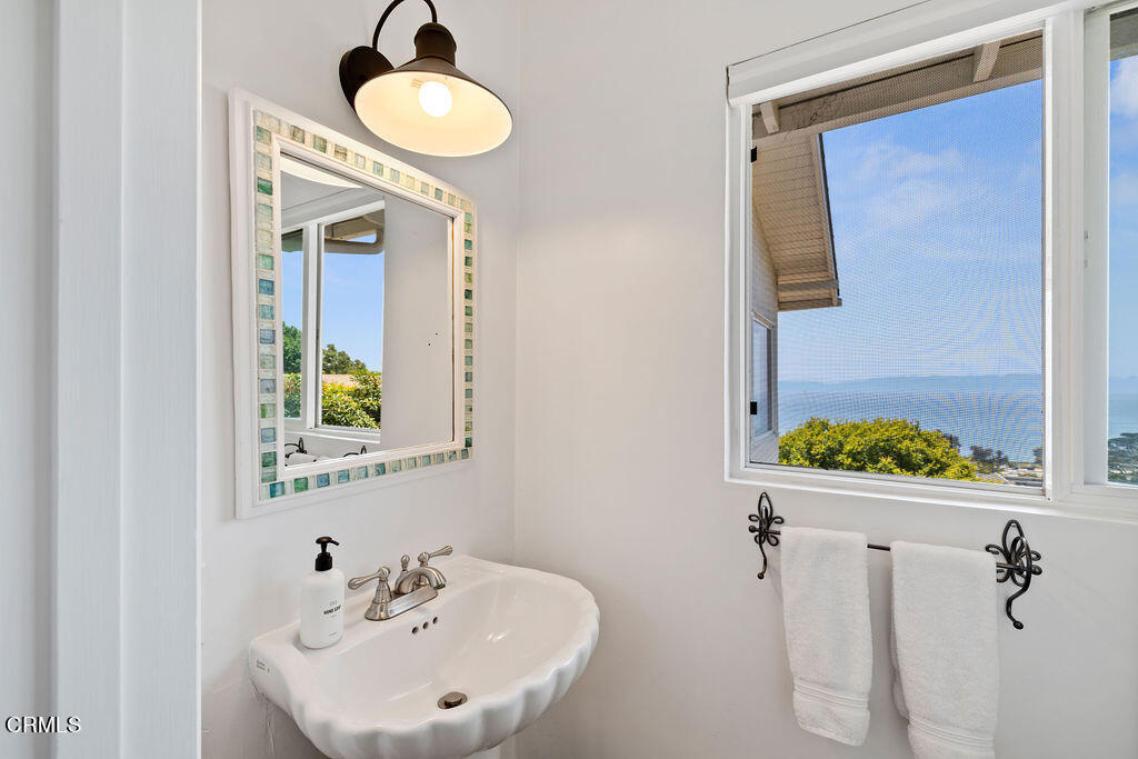 2335 Whitney Avenue Summerland, CA 93067 - Photo 25 of 33 a bathroom with a sink and a mirror