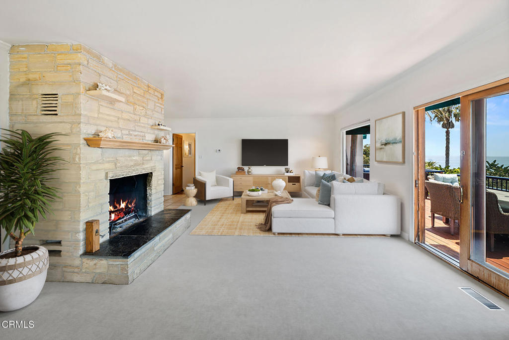 2335 Whitney Avenue Summerland, CA 93067 - Photo 9 of 33 a living room with furniture and a fireplace