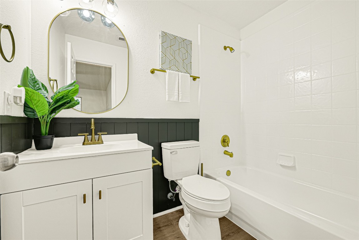 1914 Rock Ridge Drive Houston, TX 77049 - Photo 13 of 26 a bathroom with a sink a toilet and mirror