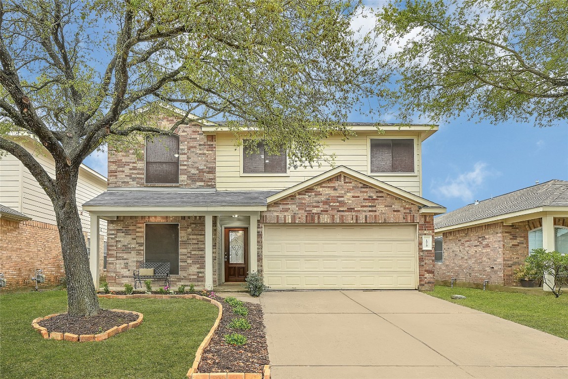 1914 Rock Ridge Drive Houston, TX 77049 - Photo 2 of 26 front view of a house with a yard