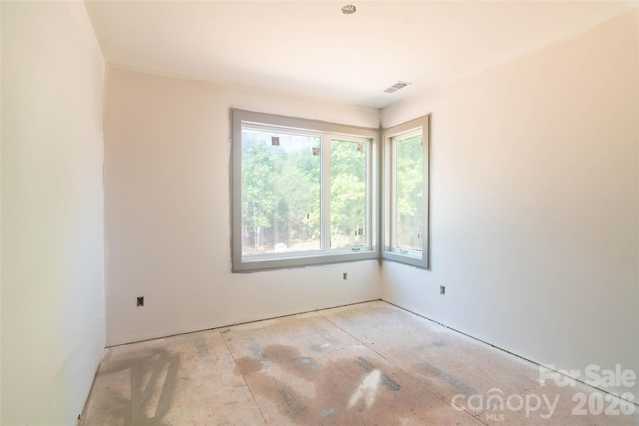 255 Hunters Trace Rutherfordton, NC 28139 - Photo 16 of 19 a view of a livingroom with an empty space and window