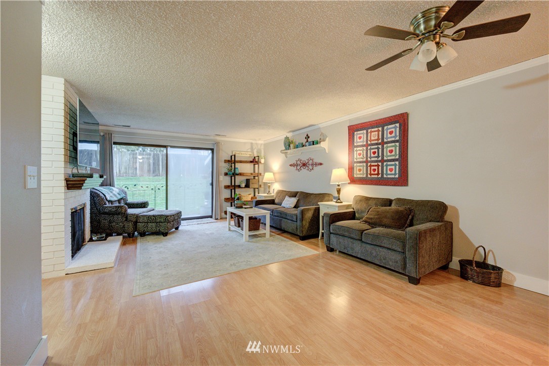 21515 4th Avenue West, Unit A72 Bothell, WA 98021 - Photo 12 of 36 a living room with furniture and a large window