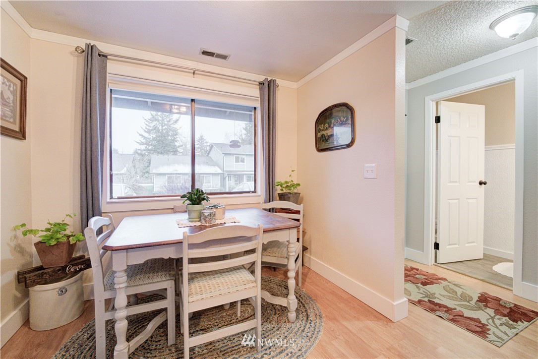 21515 4th Avenue West, Unit A72 Bothell, WA 98021 - Photo 18 of 36 a dining room with a window and furniture
