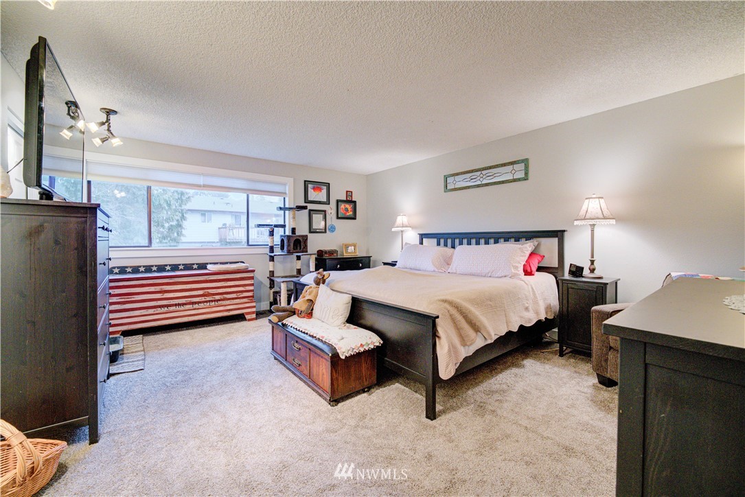 21515 4th Avenue West, Unit A72 Bothell, WA 98021 - Photo 22 of 36 a spacious bedroom with a bed and a window