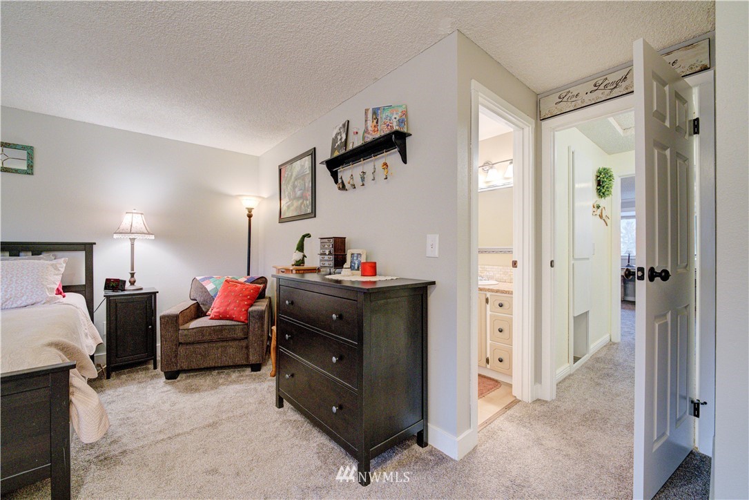 21515 4th Avenue West, Unit A72 Bothell, WA 98021 - Photo 24 of 36 a bed room with a bed and a television