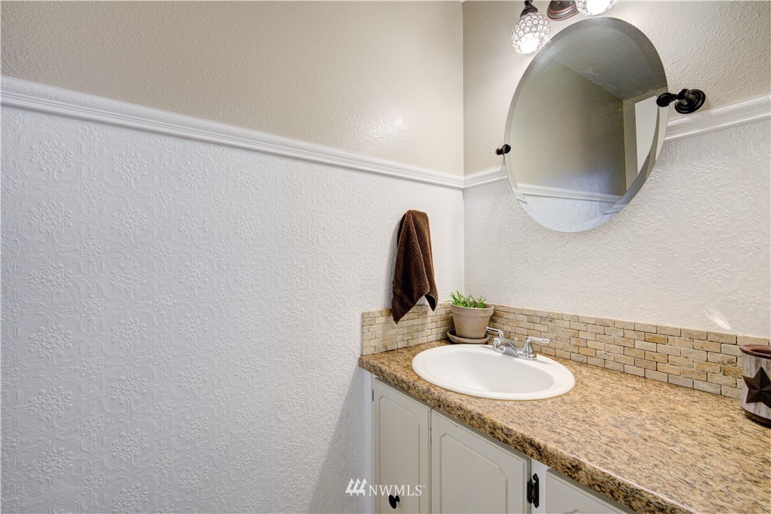 21515 4th Avenue West, Unit A72 Bothell, WA 98021 - Photo 35 of 36 a bathroom with a sink and a mirror