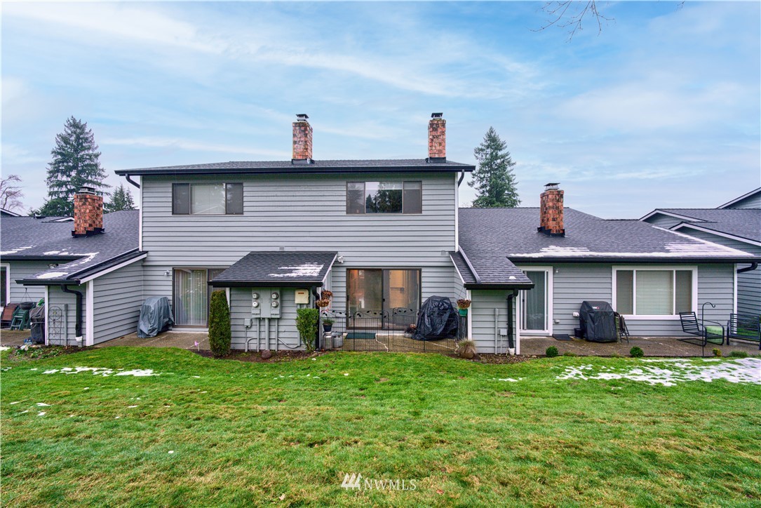 21515 4th Avenue West, Unit A72 Bothell, WA 98021 - Photo 5 of 36 a front view of a house with a yard