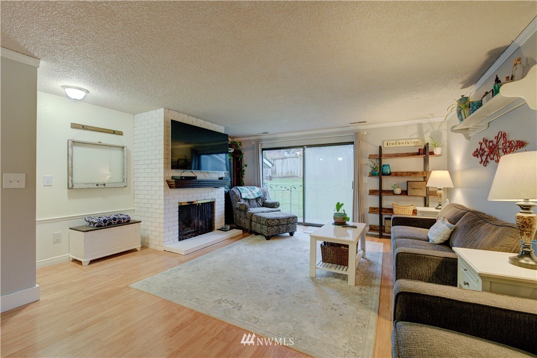 21515 4th Avenue West, Unit A72 Bothell, WA 98021 - Photo 6 of 36 a living room with furniture and a flat screen tv