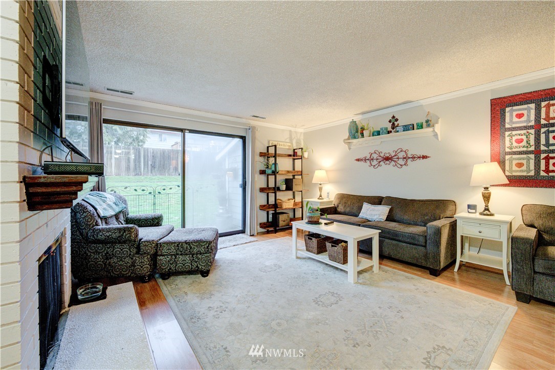 21515 4th Avenue West, Unit A72 Bothell, WA 98021 - Photo 8 of 36 a living room with furniture fireplace and a large window