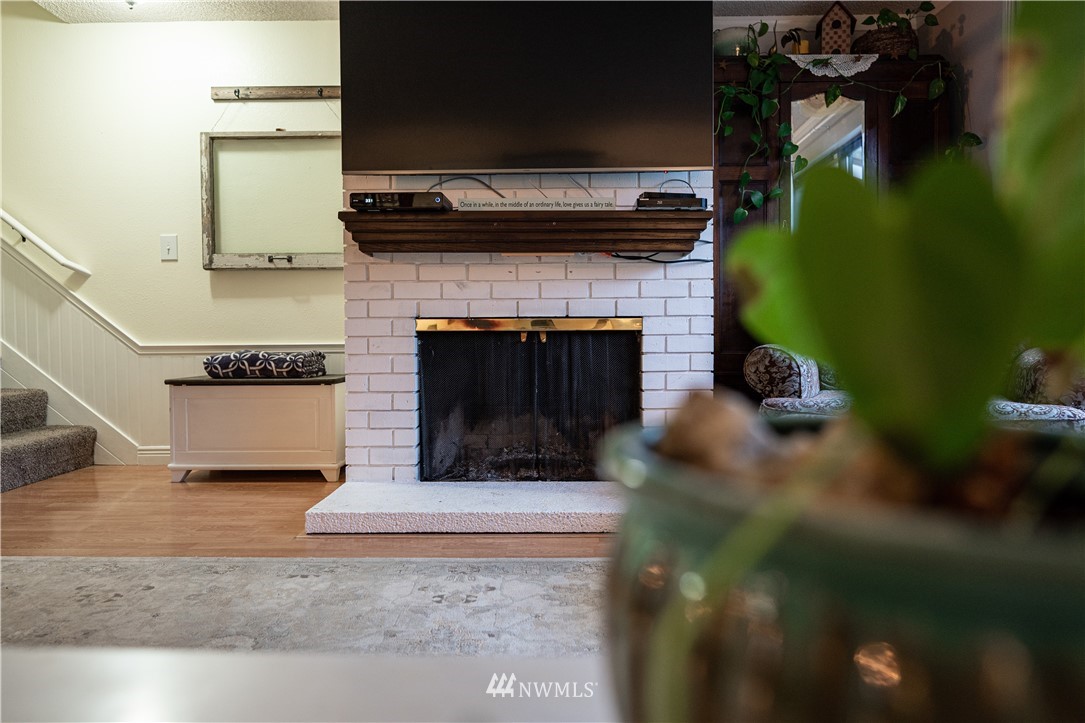 21515 4th Avenue West, Unit A72 Bothell, WA 98021 - Photo 9 of 36 a living room with furniture and a fireplace