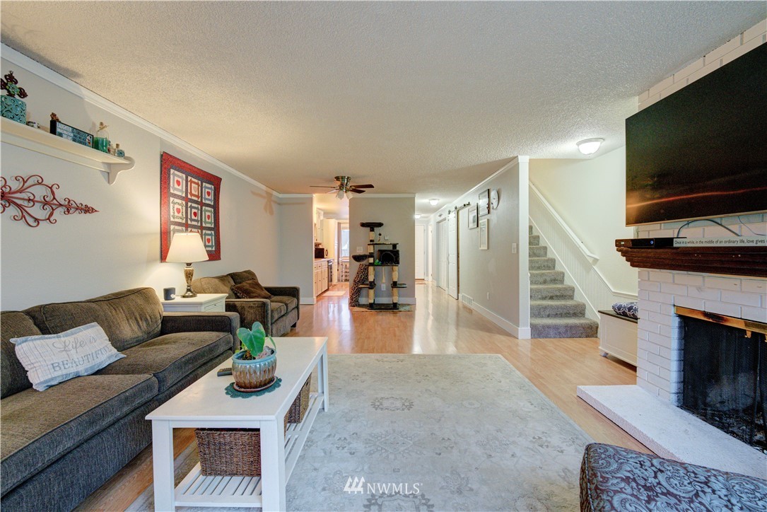 21515 4th Avenue West, Unit A72 Bothell, WA 98021 - Photo 10 of 36 a living room with furniture and a flat screen tv