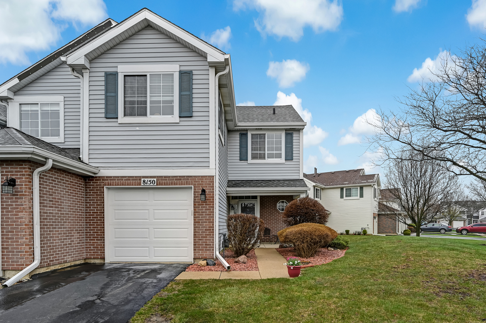 8150 Ripple Ridge Darien, IL 60561 - Photo 1 of 14 a front view of a house with a yard