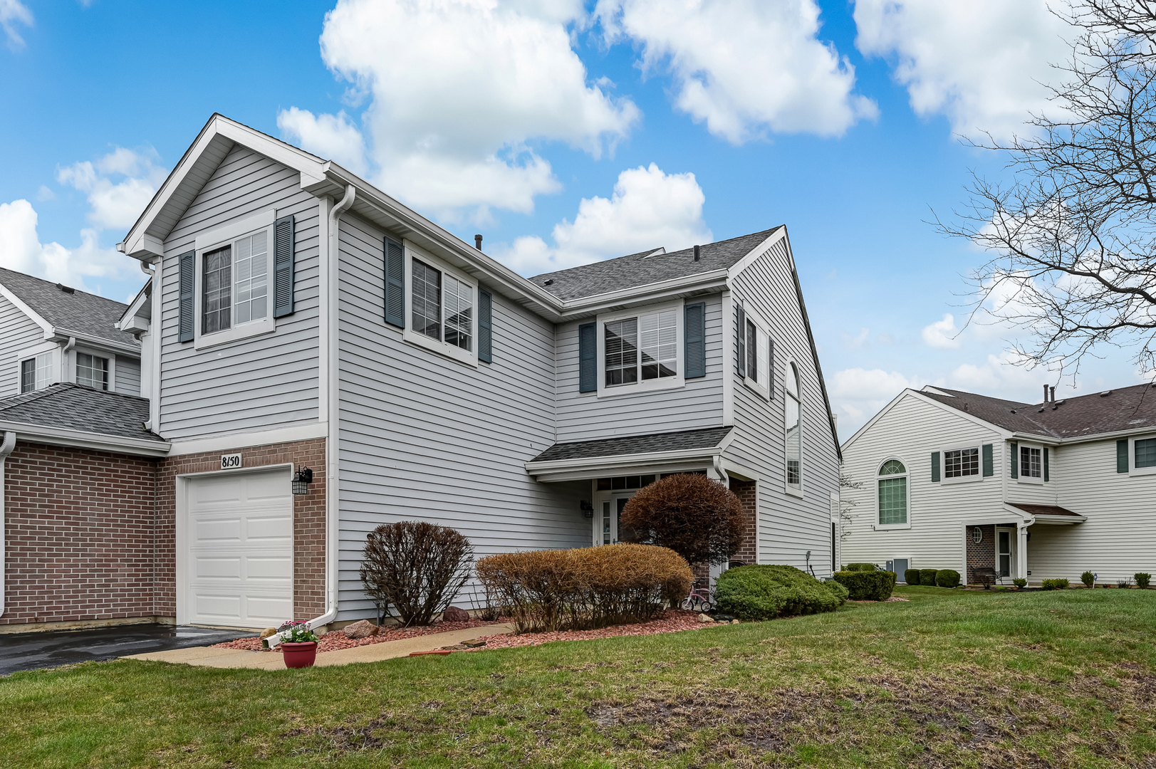 8150 Ripple Ridge Darien, IL 60561 - Photo 12 of 14 a front view of a house with a yard