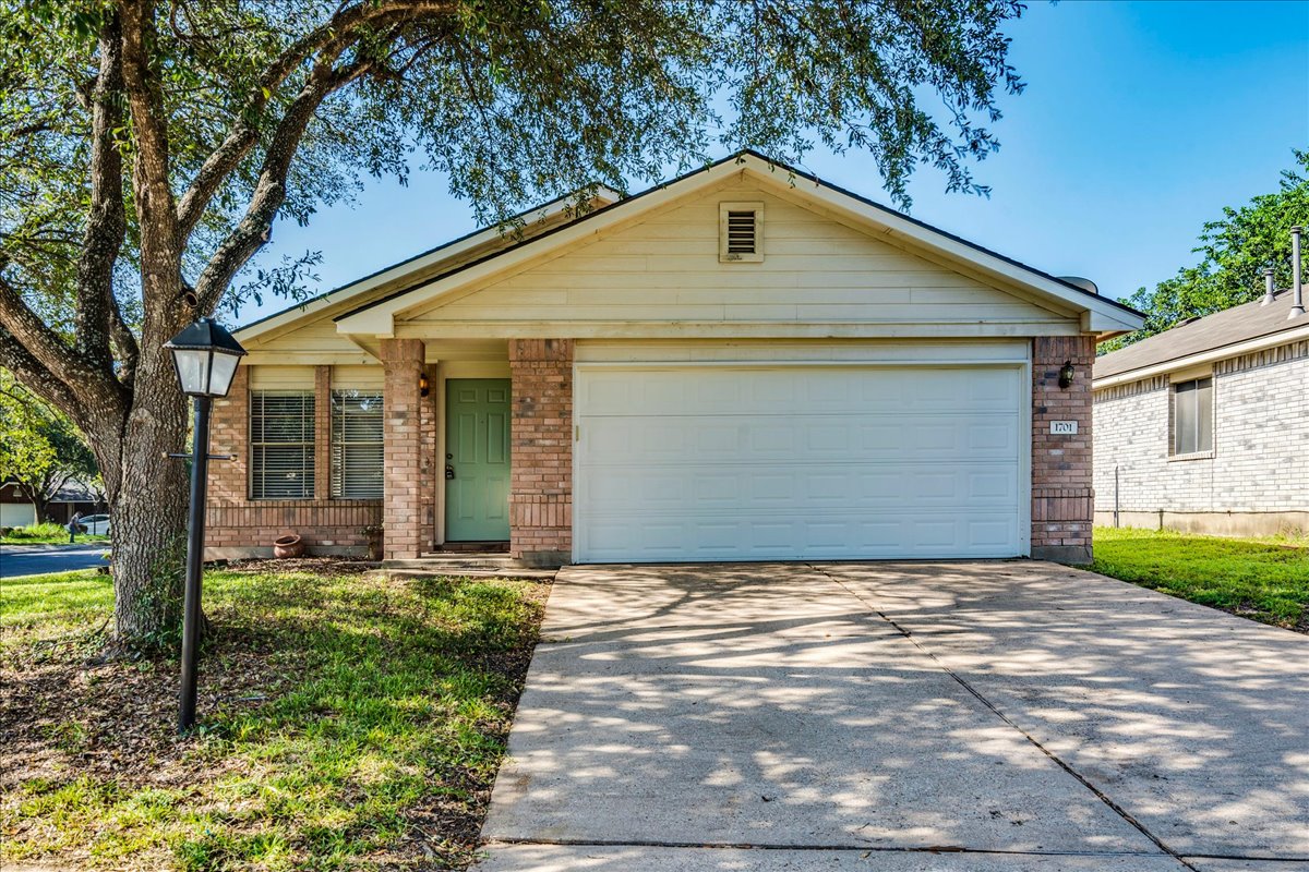 1701 Friars Tale Lane Austin, TX 78748 - Photo 1 of 1 A classic brick and siding home with a welcoming front door and an attached garage.
