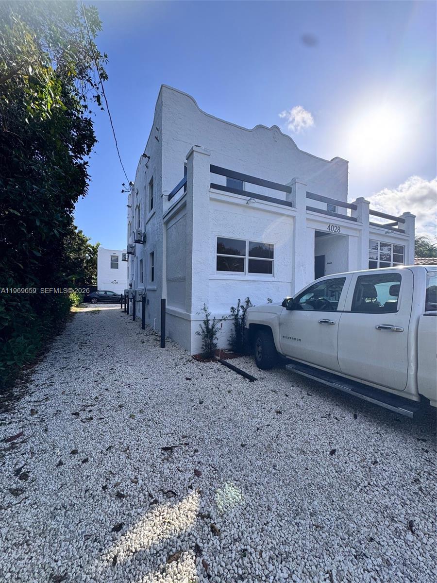 4028 Southwest 11th Street, Unit 4B Miami, FL 33134 - Photo 2 of 10 a view of a car park in front of a house