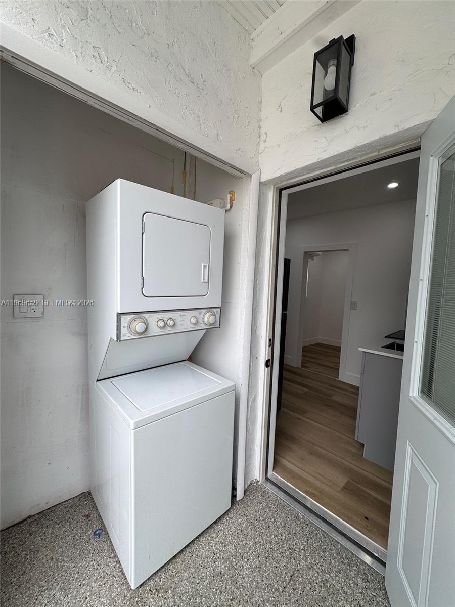 4028 Southwest 11th Street, Unit 4B Miami, FL 33134 - Photo 10 of 10 a utility room with dryer and washer