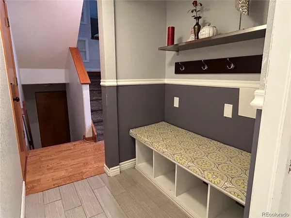 a kitchen with white cabinets and a sink