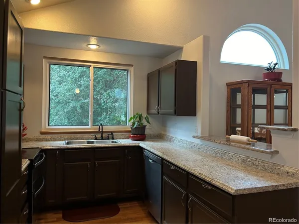 a kitchen with a sink and a window