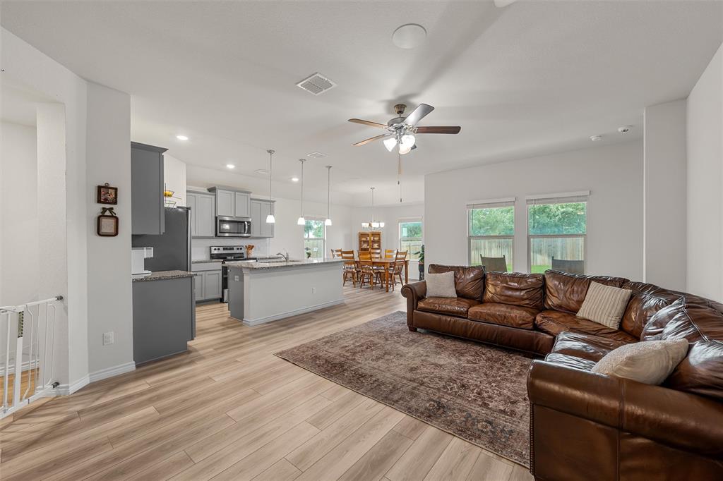 10712 Peperak Court Waco, TX 76708 - Photo 4 of 25 a living room with granite countertop furniture and kitchen view