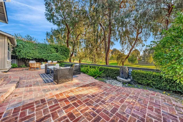a view of a chairs and tables in the garden