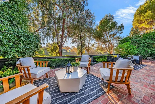 swimming pool view with a seating space