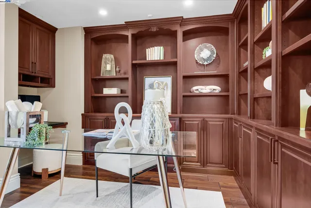 a view of a room with a table and chairs