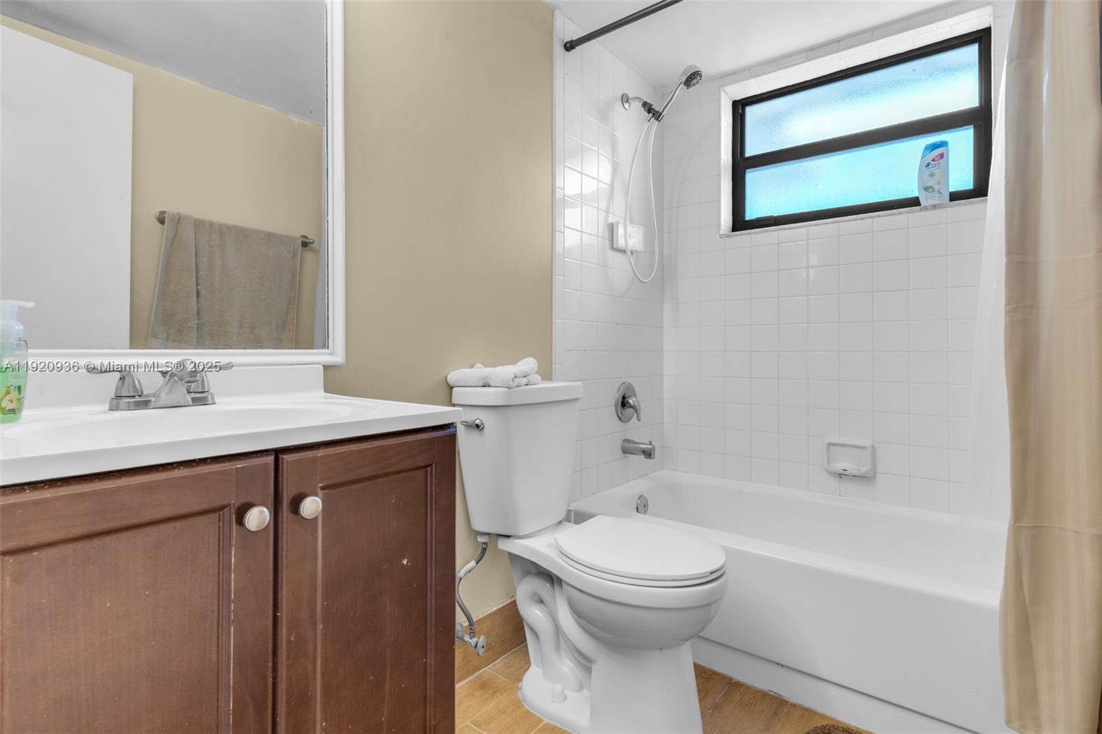 14865 Southwest 104th Street, Unit 2622 Miami, FL 33196 - Photo 13 of 24 a bathroom with a sink a toilet and shower