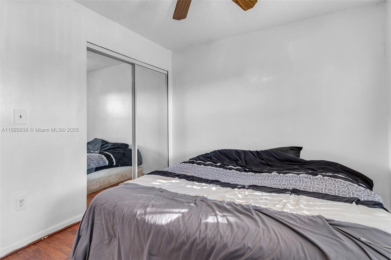 14865 Southwest 104th Street, Unit 2622 Miami, FL 33196 - Photo 15 of 24 a bedroom with a bed and cabinets