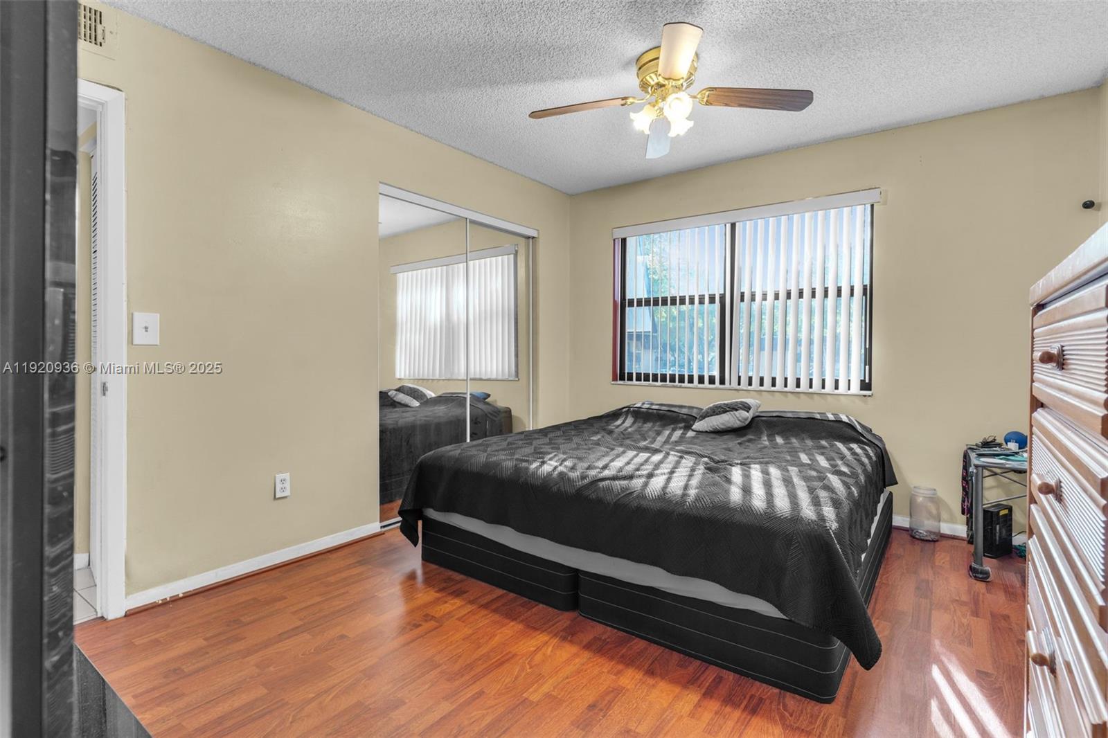14865 Southwest 104th Street, Unit 2622 Miami, FL 33196 - Photo 17 of 24 a bedroom with a bed and a chandelier