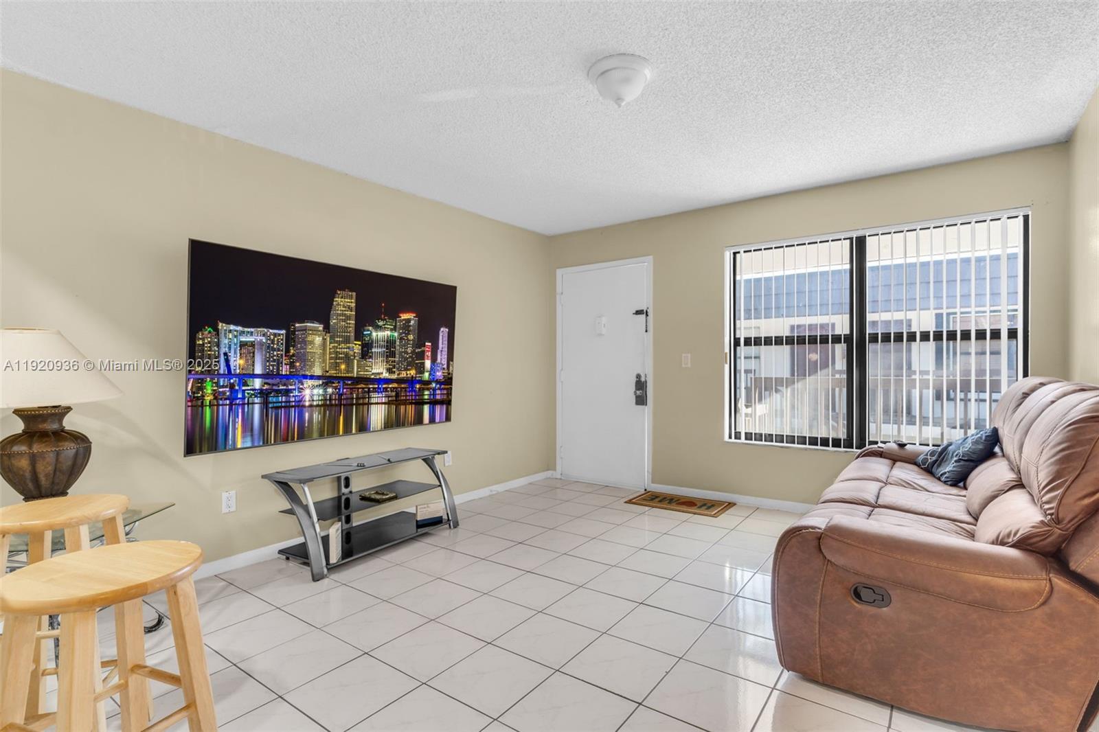 14865 Southwest 104th Street, Unit 2622 Miami, FL 33196 - Photo 4 of 24 a living room with furniture and a window