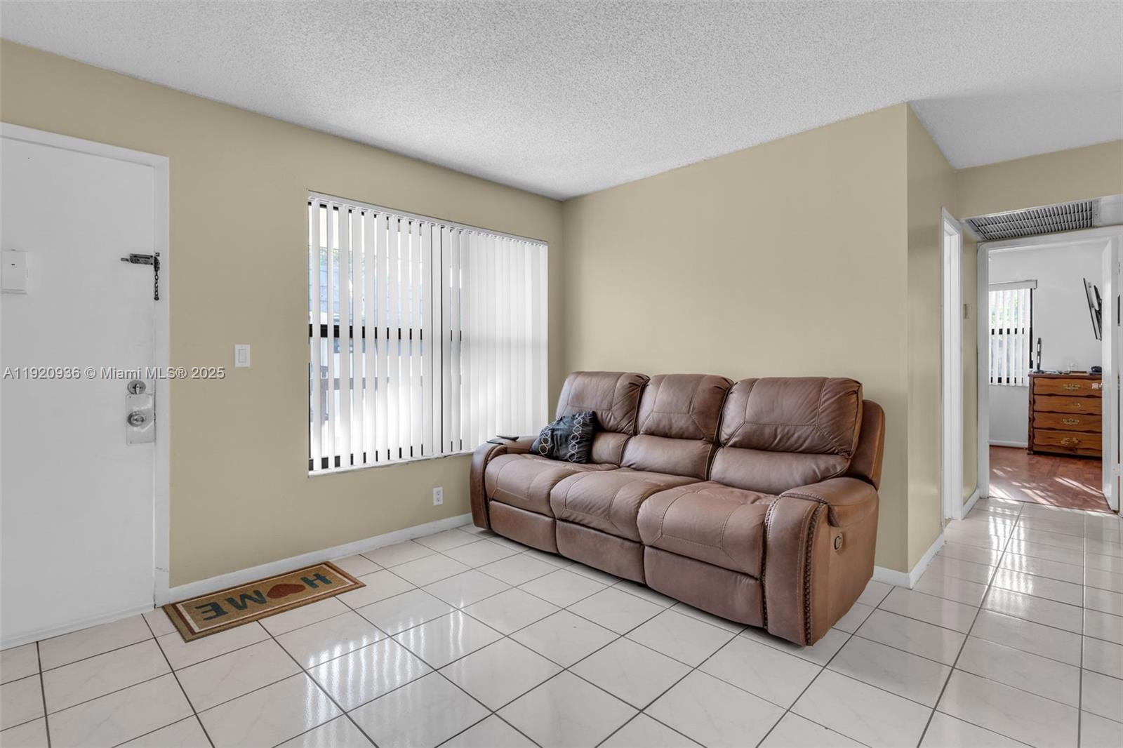 14865 Southwest 104th Street, Unit 2622 Miami, FL 33196 - Photo 5 of 24 a living room with furniture and a window