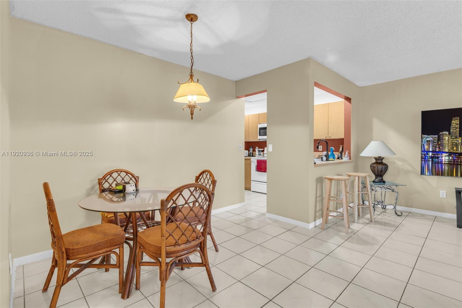 14865 Southwest 104th Street, Unit 2622 Miami, FL 33196 - Photo 7 of 24 a view of a dining room with furniture and chandelier