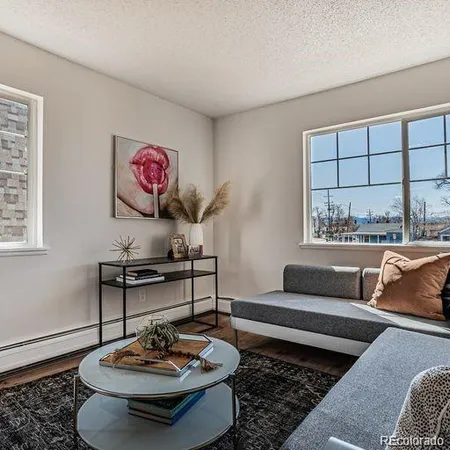a living room with furniture and a table