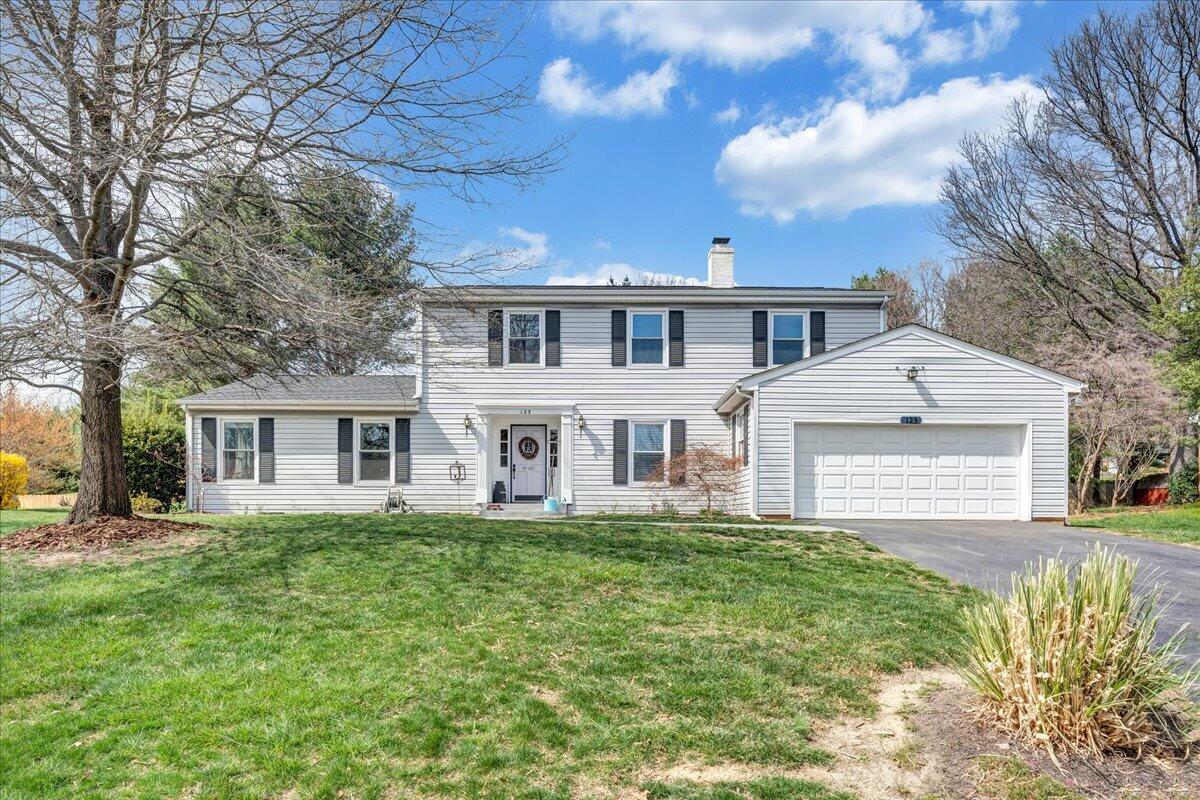 123 Bartley Drive Salem, VA 24153 - Photo 1 of 57 a front view of a house with a yard and trees