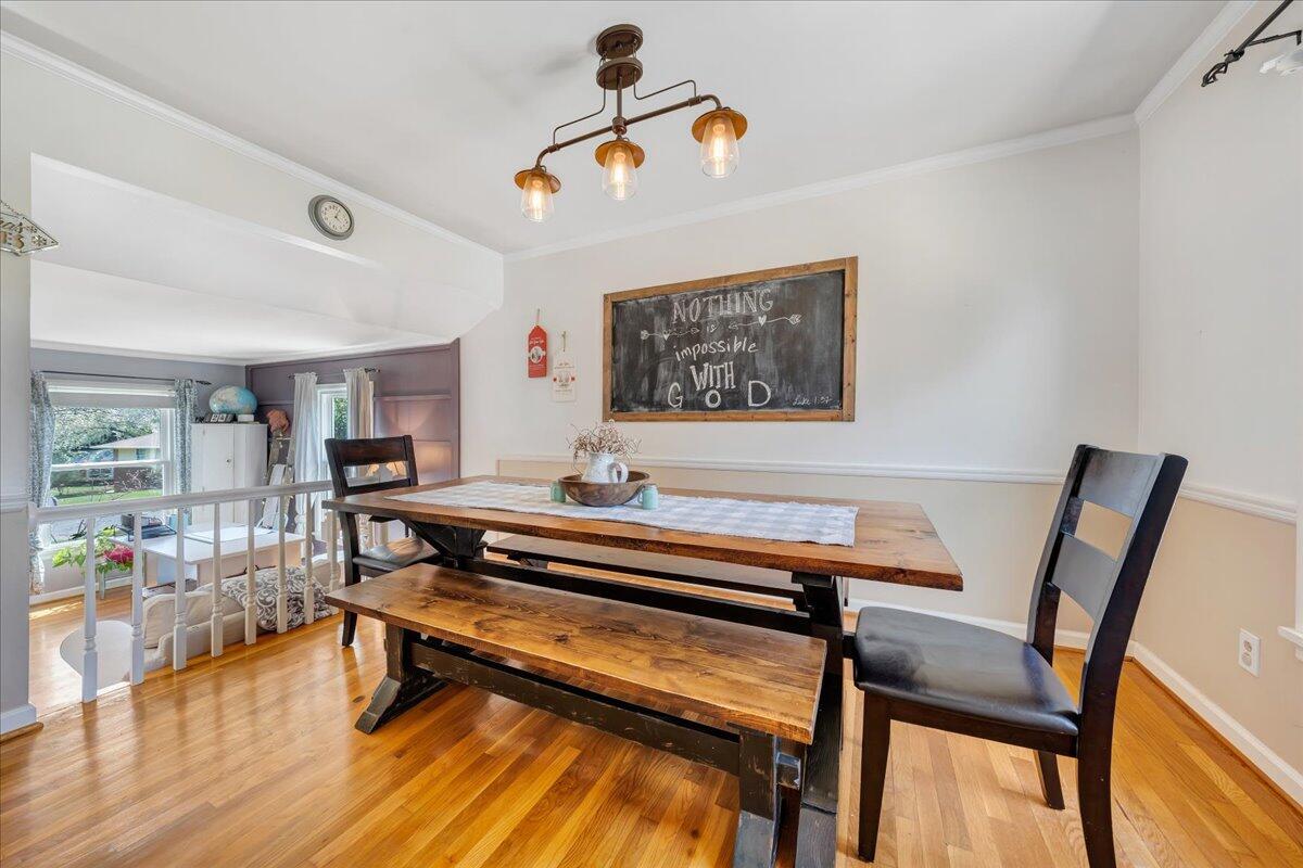 123 Bartley Drive Salem, VA 24153 - Photo 13 of 57 a living room with dining table a window and wooden floor
