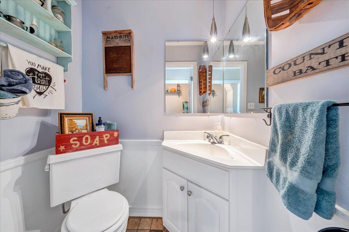 123 Bartley Drive Salem, VA 24153 - Photo 31 of 57 a bathroom with a sink a toilet and a mirror
