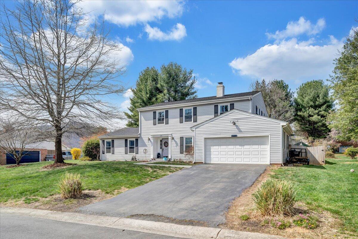 123 Bartley Drive Salem, VA 24153 - Photo 53 of 57 a front view of a house with a yard and garage