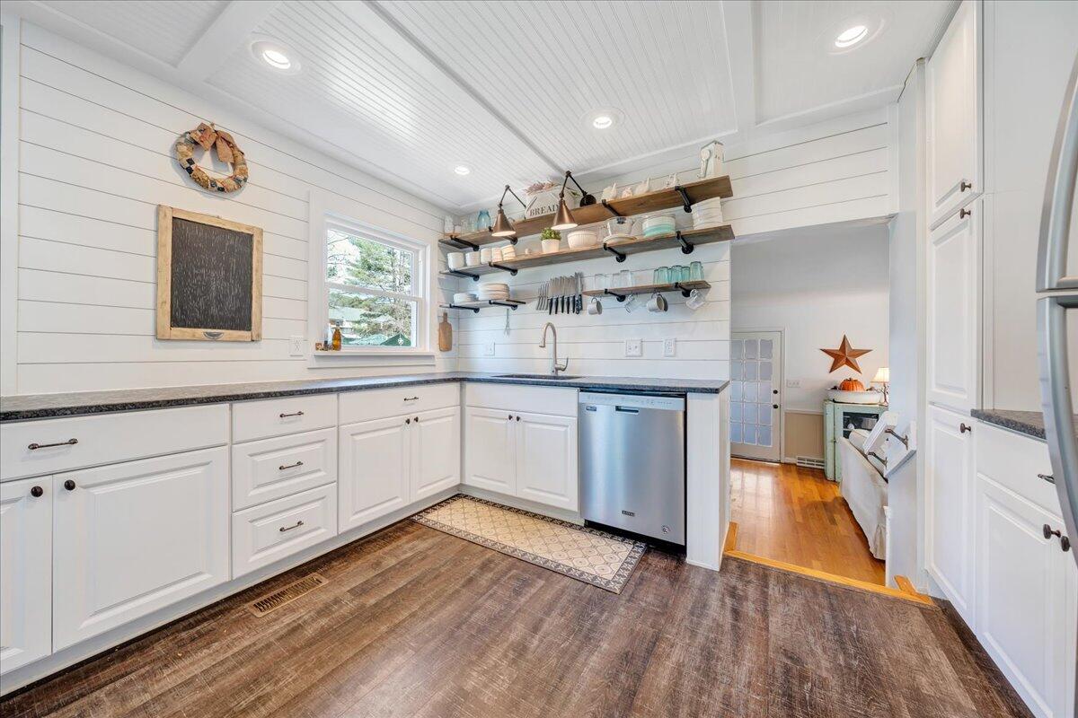 123 Bartley Drive Salem, VA 24153 - Photo 7 of 57 a kitchen with a sink stainless steel appliances and cabinets