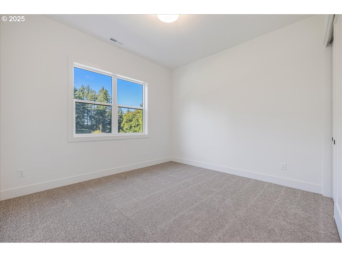 7168 Southeast Eola Hills Road Amity, OR 97101 - Photo 16 of 34 a view of an empty room with a window