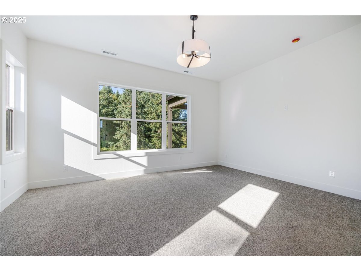 7168 Southeast Eola Hills Road Amity, OR 97101 - Photo 24 of 34 a view of an empty room with a window